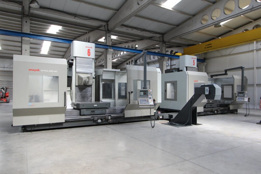 Industrial machinery factory floor with precision CNC equipment and metal components