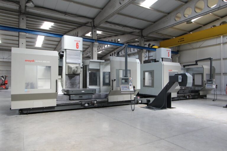 Industrial machinery factory floor with precision CNC equipment and metal components