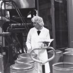 Pharmaceutical active ingredient manufacturing facility with stainless steel processing equipment, representing supplier financial risk monitoring