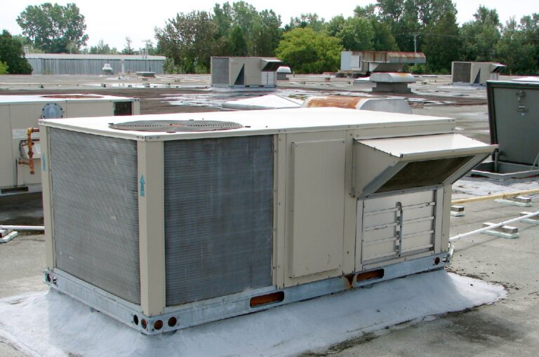 Industrial HVAC compressor and refrigerant piping in a mechanical equipment room