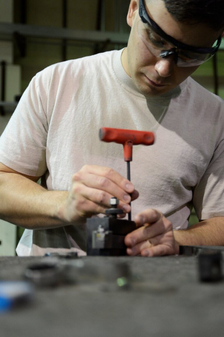 CNC machining of a precision hydraulic component on an industrial machinery factory floor