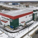 Medical device manufacturing facility exterior representing precision component production and supply chain risk