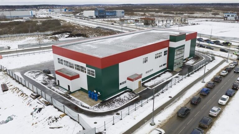 Medical device manufacturing facility exterior representing precision component production and supply chain risk