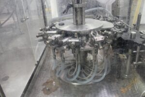 Consumer goods packaging and bottling line in a manufacturing facility