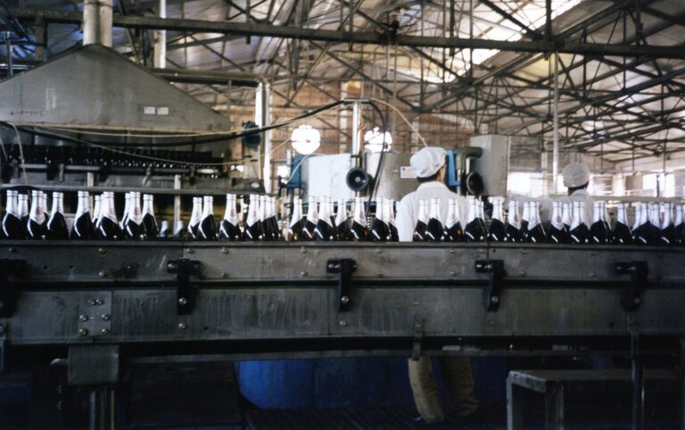 Beverage bottling line in a food and beverage plant, illustrating geopolitical supply chain risk to food and beverage suppliers