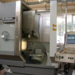 CNC machining center on an industrial machinery shop floor, illustrating industrial machinery supply chain risk