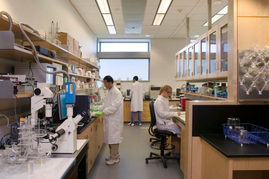 Cleanroom technician inspecting medical device components for FDA QMSR supplier compliance