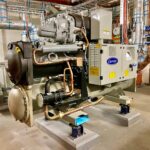 Water-cooled HVAC chiller in a commercial building plant room, illustrating how to quantify supply chain exposure for HVAC component suppliers