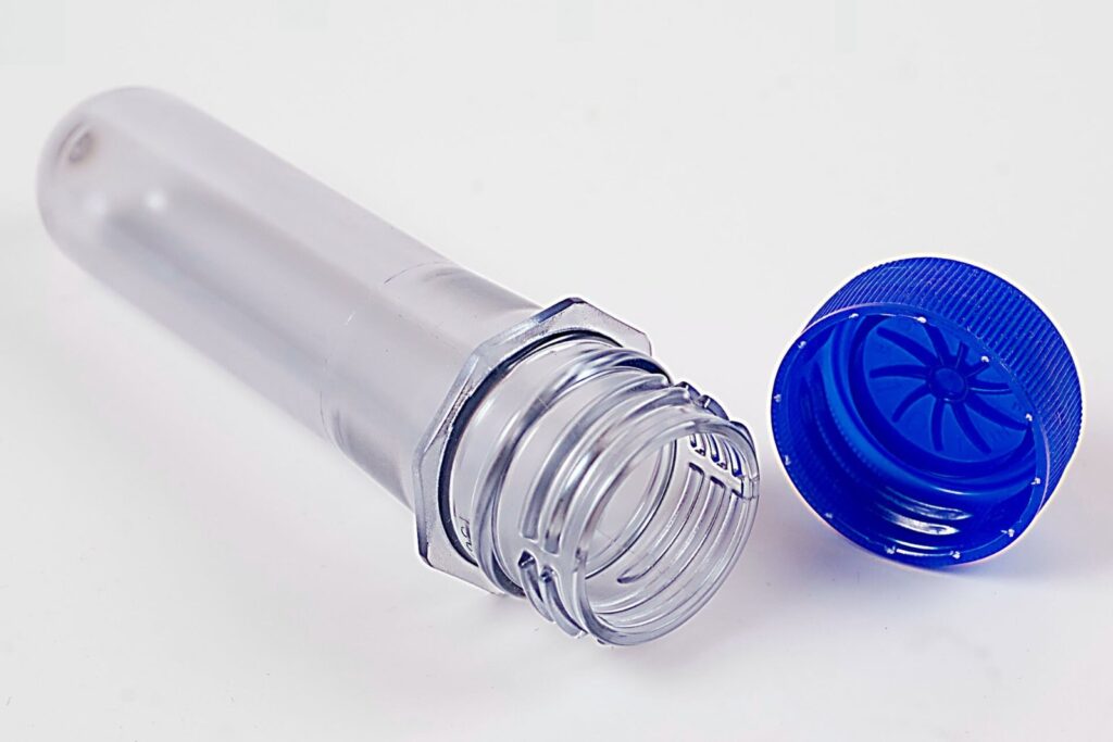 PET plastic preform with polyethylene cap, illustrating tier 2 supplier visibility in consumer goods packaging resin supply chains