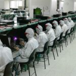 Cleanroom electronics assembly line where component supply drives predictive supply chain analytics for medical device makers
